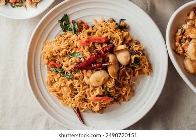 Hong Kong style stir fried noodles are cooked with high heat flames Pad Thai is a popular Thai street food made with fried rice noodles - Powered by Shutterstock