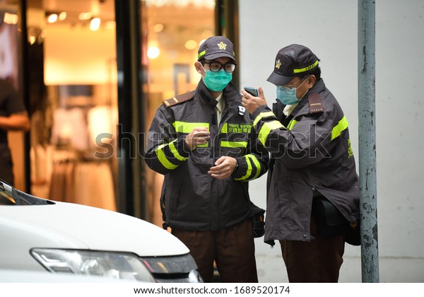 HONG KONG,Central,2020MAR30, under Wuhan plague\
outbreak emergency, in military thug tyranny failed state,armed\
Police Force rioter with mask illegally stop & search innocent\
car on road