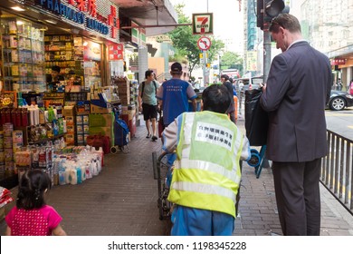 Hong Kong/China, October 23 2015: Crowd Walking On City Road, Hong Kong Ranks 7th On The UN Human Development Index And Has The Seventh-highest Life Expectancy In The World