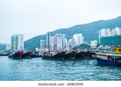 HONG KONG-MARCH 12:Traditional Fishing Trawler In The Aberdeen Bay. Famous Floating Village In Aberdeen Is An Area And Town On The South Shore Of HongKong Island In Partly Cloudy Day On March 12 ,2015