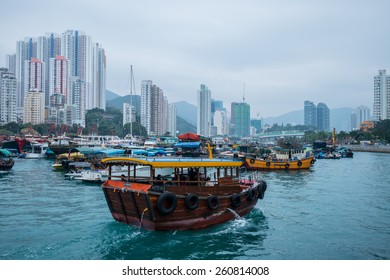 HONG KONG-MARCH 12:Traditional Fishing Trawler In The Aberdeen Bay. Famous Floating Village In Aberdeen Is An Area And Town On The South Shore Of HongKong Island In Partly Cloudy Day On March 12 ,2015