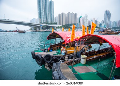 HONG KONG-MARCH 12:Traditional Fishing Trawler In The Aberdeen Bay. Famous Floating Village In Aberdeen Is An Area And Town On The South Shore Of HongKong Island In Partly Cloudy Day On March 12 ,2015