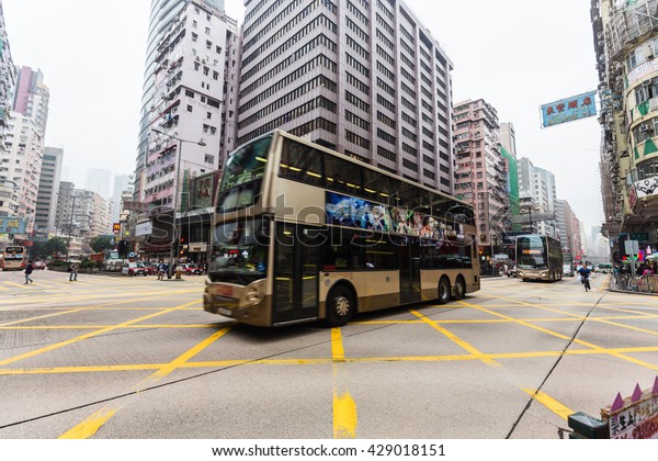 HONGKONG - FEBRUARY 22, 2016:\
The traffic road and building at down town in rush hour in twilight\
time.