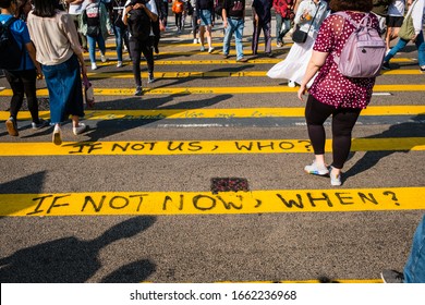 HongKong - November, 2019: Graffiti on    pedestrian crossing reading "If not us, who ? If not now, when ?" during the 2019 HongKong protests, a series of demonstrations in Hong Kong