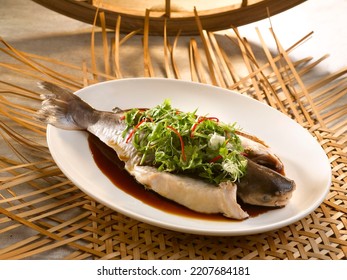Hongkong Steamed fish Uncle Lapan served in a dish isolated on table side view