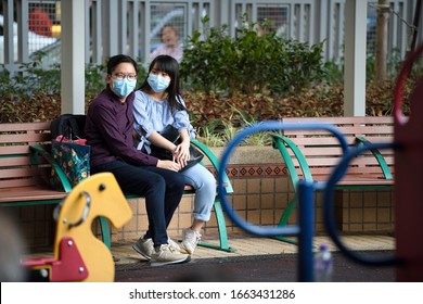 HONGKONG,Jordan,2020Feb29,couple In A Park,under Wuhan Plague Outbreak Emergency,wearing Mask For Protection Of Corona Virus Spread In The fearsociety & Failed State