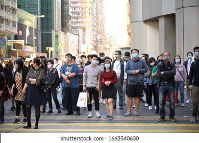 HONGKONG,Yau Ma Tei,2020MAR1,under Wuhan plague outbreak emergency, people in street wearing mask for corona virus spread in the fear society& failed state
