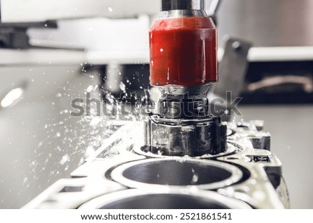 Honing of engine cylinder on CNC Vertical Machine, close up. Car workshop, tuning and repair of engine power. Overhaul of the engine. Machine with ideal bore finish. 