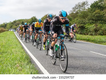 HONITON, UNITED KINGDOM - SEPTEMBER 20: Bradley Wiggins In The IG Yellow Jersey In The Pack Of The Devon Stage Of The Tour Of Britain Cycle Race On September 20, 2013 In Honiton, United Kingdom