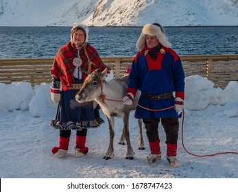 Honnigsvag, Norway - 02 15 20, Two Sami With Reindeer In Traditional Costume

