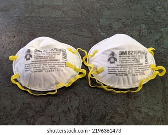 Honolulu - August 1, 2020: Two White N95 Face Masks With Yellow Ear Straps Made By 3M On Floor.