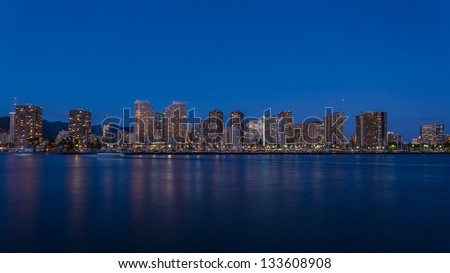 Honolulu downtown at night with seafront