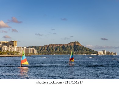 Honolulu, Hawaii - circa February 2022: Sailboats at Ala Moana Beach Park, with Diamond Head and the city skyline beyond.