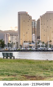 Honolulu, Hawaii - circa February 2022: Focus on a bench overlooking beautiful scenery at the harbor at Ala Moana.