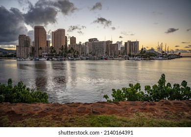 Honolulu, Hawaii - circa February 2022: The city skyline visible at sunset at Ala Moana harbor.