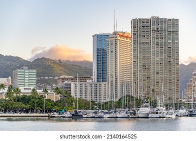 Honolulu, Hawaii - circa February 2022: The city skyline with boats in the harbor at Ala Moana State Park.