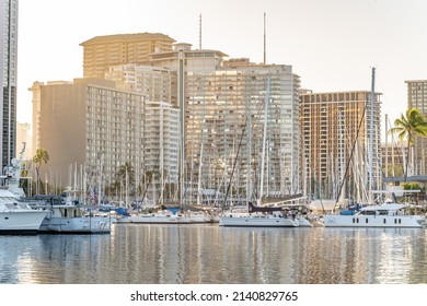 Honolulu, Hawaii - circa February 2022: The city skyline and boats in the harbor at Ala Moana State Park.