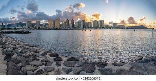 Honolulu, Hawaii - circa February 2022: Panoramic view of the beautiful city skyline from Ala Moana harbor. Buildings in focus in the distance.