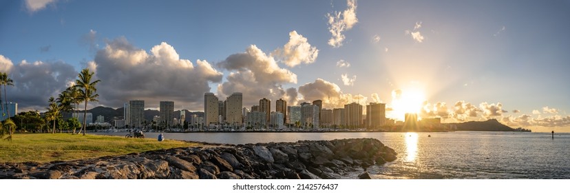 Honolulu, Hawaii - circa February 2022: Panoramic view of the beautiful city skyline from Ala Moana harbor. Buildings in focus in the distance.