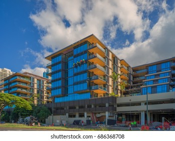 Honolulu, Hawaii, July 29, 2017:  Construction panorama of new Honolulu Condominiums with a blue sky above.