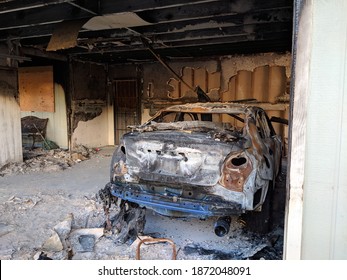 Honolulu, Hawaii - November 2, 2018: Inside Garage after a fire with burnt walls, ceiling and car on Oahu, Hawaii.