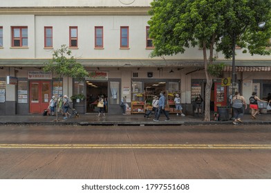 Honolulu, Hawaii, USA.  Aug. 17, 2020, Rain Soaking The Dirty Buildings And Streets Of The Open Market As Honolulu Residents Brave The Covid 19 Epidemic To Shop For Food And Take Out Hot Foods.