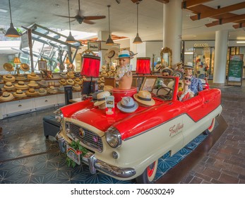 Honolulu, Hawaii, USA, August 30, 2017:  Recent store addition at the 
Ala Moana Shopping Center with a restored auto and mannequins wearing fashionable straw hats.