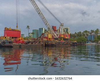 Honolulu, Hawaii, USA.  Feb. 1, 2020.  Undersea Cable Being Installed By An All Male Barge Crew Under The Direction Of A Female Engineer.