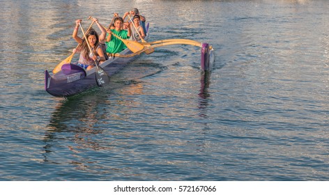 Honolulu, Hawaii, USA, Feb 6, 2017:  Young Hawaiian boys and girls paddling an outrigger canoe in Waikiki.