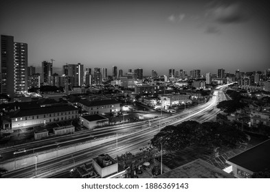 Honolulu, Hawaii, USA.  January 1, 2021.  Honolulu City Lights Long Exposure With Heavy Nighttime Traffic On The H-1 Freeway.
