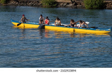 Honolulu, Hawaii, USA.  January 8, 2022.  High School Woman's outrigger canoe team at the Ala Wai Harbor in Waikiki.