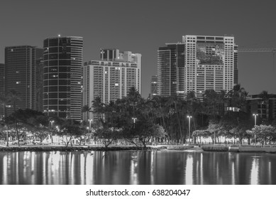 Honolulu, Hawaii, USA, May 11, 2017:  Night panorama of the Ala Moana District with the Ala Wai Harbor in the foreground.