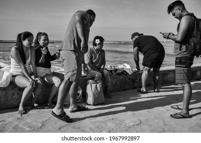 Honolulu, Hawaii, USA.  May 5, 2021.  Hawaiian Family Enjoying Brunch At 
The Wall Surf Spot In Waikiki.