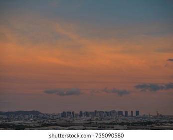 Honolulu, Hawaii, USA, Oct. 16, 2017:  Autumn Sunset Panorama Above Honolulu Town With Punch Bowl National Monument To Photograph Left.