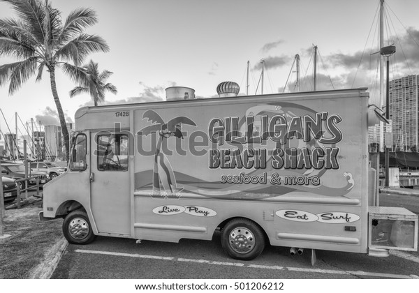 Honolulu, Hawaii,\
USA, Oct. 20, 2016:  Hawaiian plate lunch truck parked in Waikiki\
with hotels in the\
backdrop.