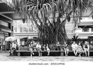 Honolulu, Hawaii, USA.  October 10, 2021.  Friends sitting and enjoying a warm autumn afternoon at Ala Moana Center.