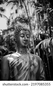 Honolulu, Hawaii, USA.  September 2, 2022.  Peaceful Portrait Of An Old Bronze Statue Along The Hiking Path At The Lyon Arboretum  In The Manoa Valley.