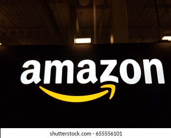 HONOLULU - JANUARY 12, 2017:  Amazon logo on black shiny wall in Honolulu Best Buy store.  Amazon is American international electronic commerce company. It's world's largest online retailer.