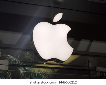 Honolulu - June 27, 2014: Close-up of The Apple retail store Logo in Honolulu at the Ala Moana Center.  Advertising the latest generation of the ipad, iphones, and ipods with a Retina display.