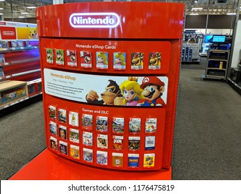 Honolulu - March 7, 2018: Nintendo EShop Cards, Games And DLC Display Featuring Iconic Characters Donkey Kong, Princess Toadstool, And Mario Inside Best Buy Store. 