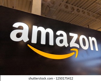 Honolulu - May 29, 2018:  Amazon logo on black shiny wall in Honolulu Best Buy store.  Amazon is an American international electronic commerce company. It is the world's largest online retailer.