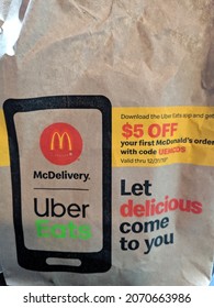 Honolulu - October 2, 2019: Paper Bag Of McDonald's Food With MCDelivery Uber Eats Ad Printed On Side Of Bag.