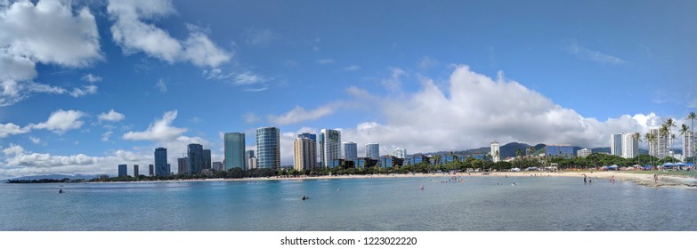 Honolulu - September 30, 2018:  Ala Moana Beach Park with office building and condos in the background during a beautiful day on the island of Oahu, Hawaii. 