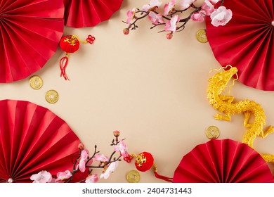 Honoring the essence of a traditional Chinese New Year. Top view shot of gold dragon, red paper fans, traditional coins, decorative items, sakura bloom on beige background with promo placement - Powered by Shutterstock