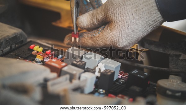 Hood of\
the car - electric repair, electrical\
wiring