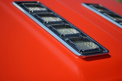 Hood Ornaments On Classic Red Car