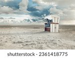 Hooded beach chair on the beach at the north sea