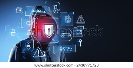 Hooded man hacker, double exposure glowing online cybersecurity icons, padlock shield and warning sign. Concept of business privacy, cyber attack, danger and leak