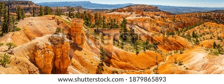 Hoodoos and eroded sandstone formations along the Queen's Garden and Navajo Loop hiking trails at Bryce Canyon National Park in Utah.