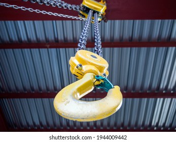 Hook of a hand loader under the ceiling of a building